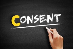 word consent written on blackboard in chalk